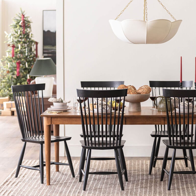 dining room scene with dining set and holiday tree