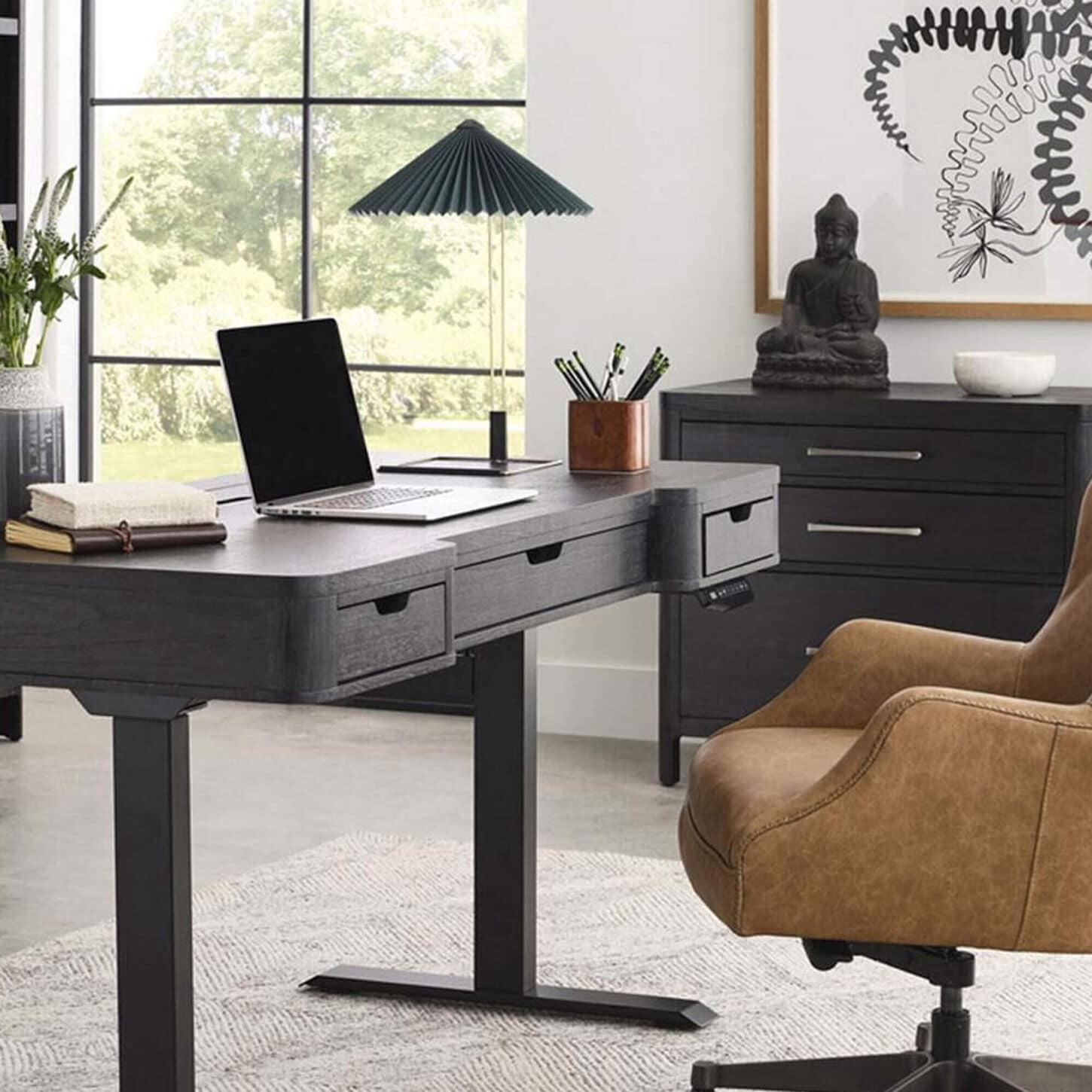 Laptop sitting on a writing desk