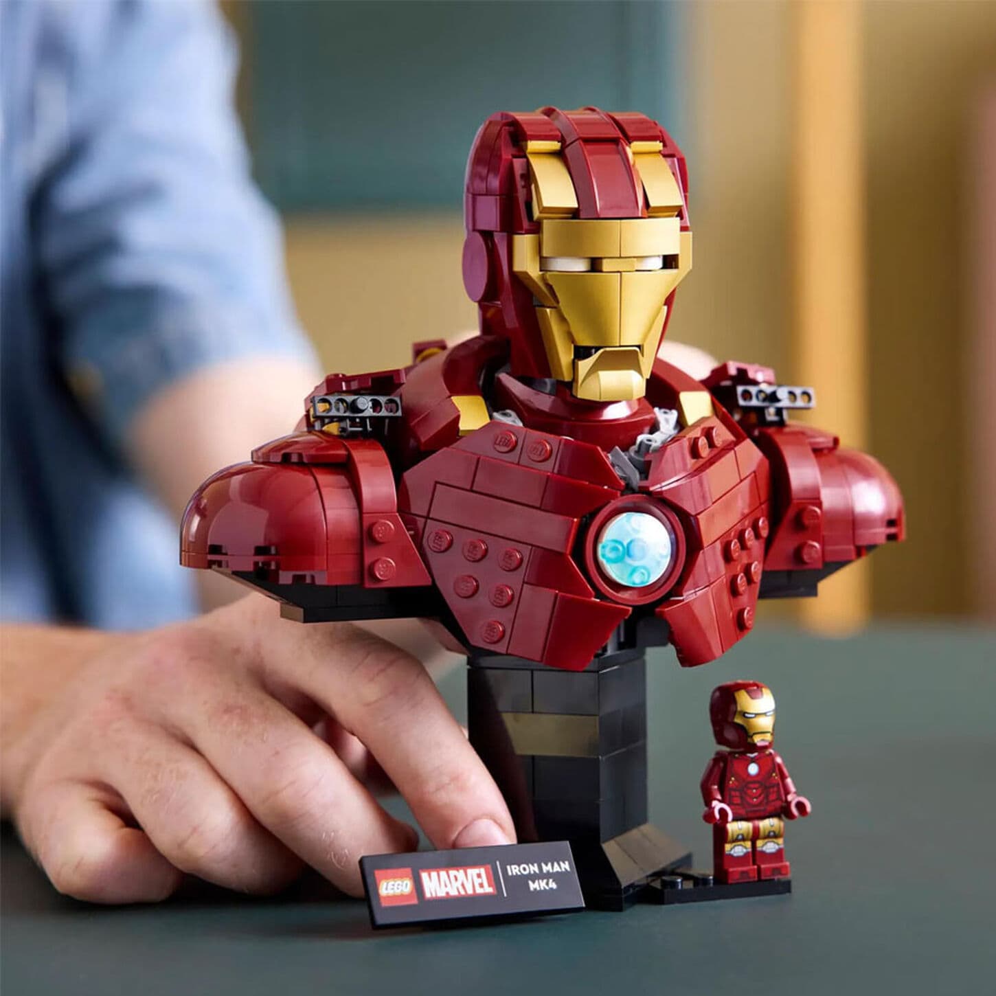 Young boy playing with a Hot Wheels City 50 Mega Garage in Blue/Orange.