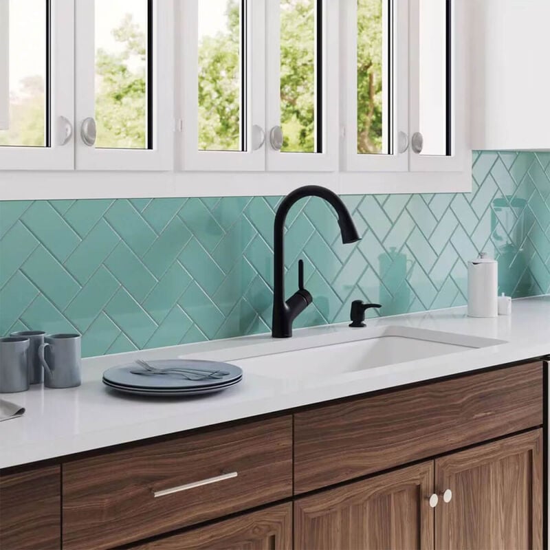 kitchen with white countetops bronze single handle faucet with green subway tile backsplash