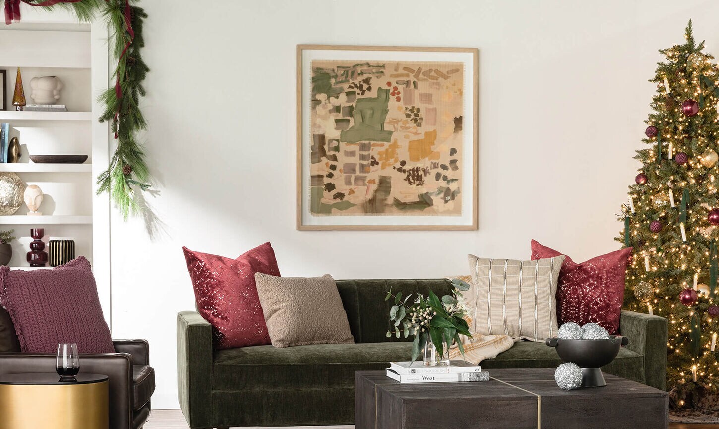 A beautiful living room with Christmas d&eacute;cor with reds, greens and gold.