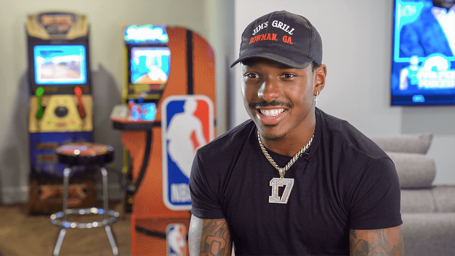 Mecole Hardman smiling in game room with arcade games