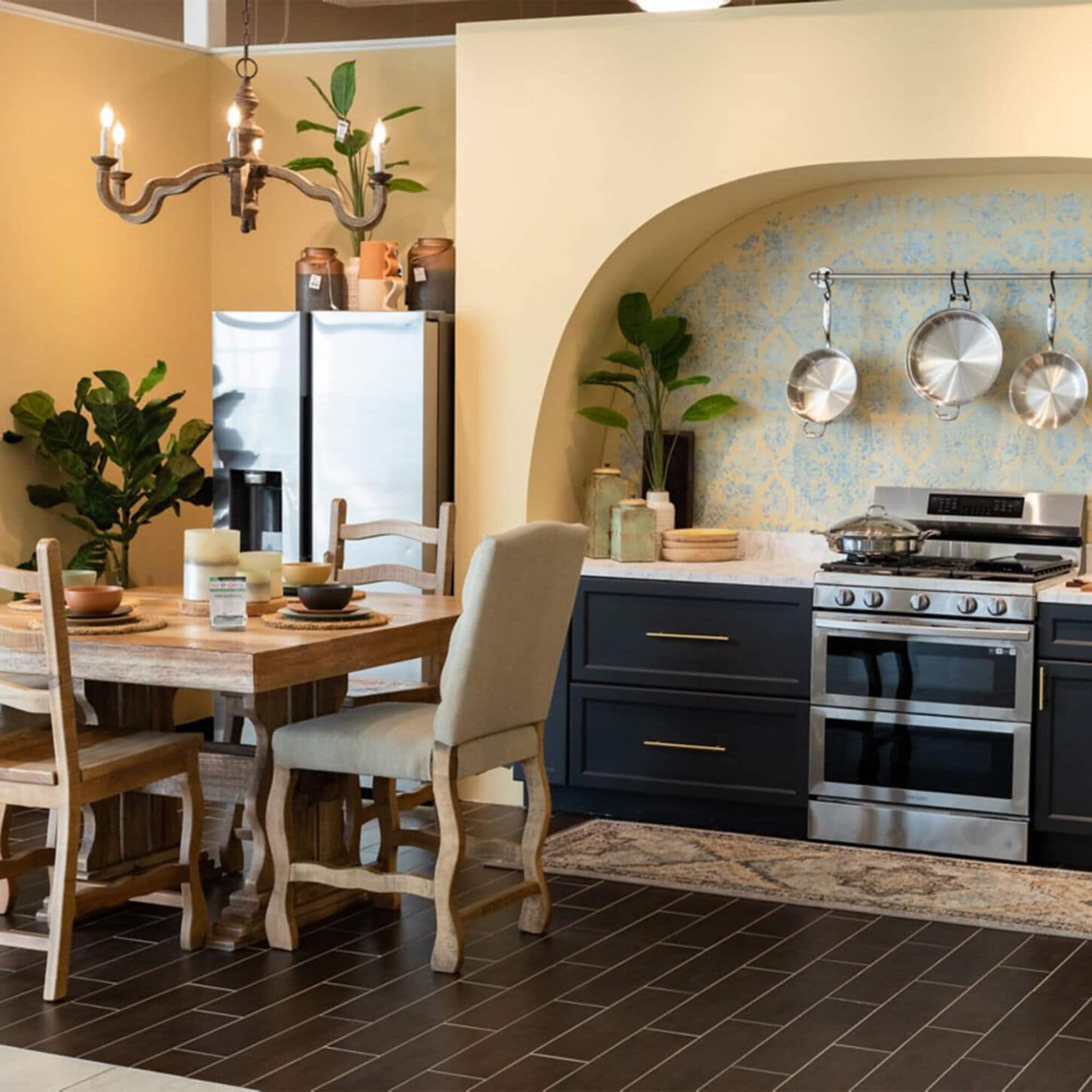 kitchen with dark wood cabinets and a light wood dining set to the left