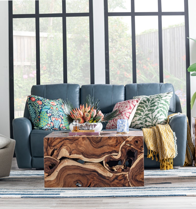 Blue leather couch with wood table
