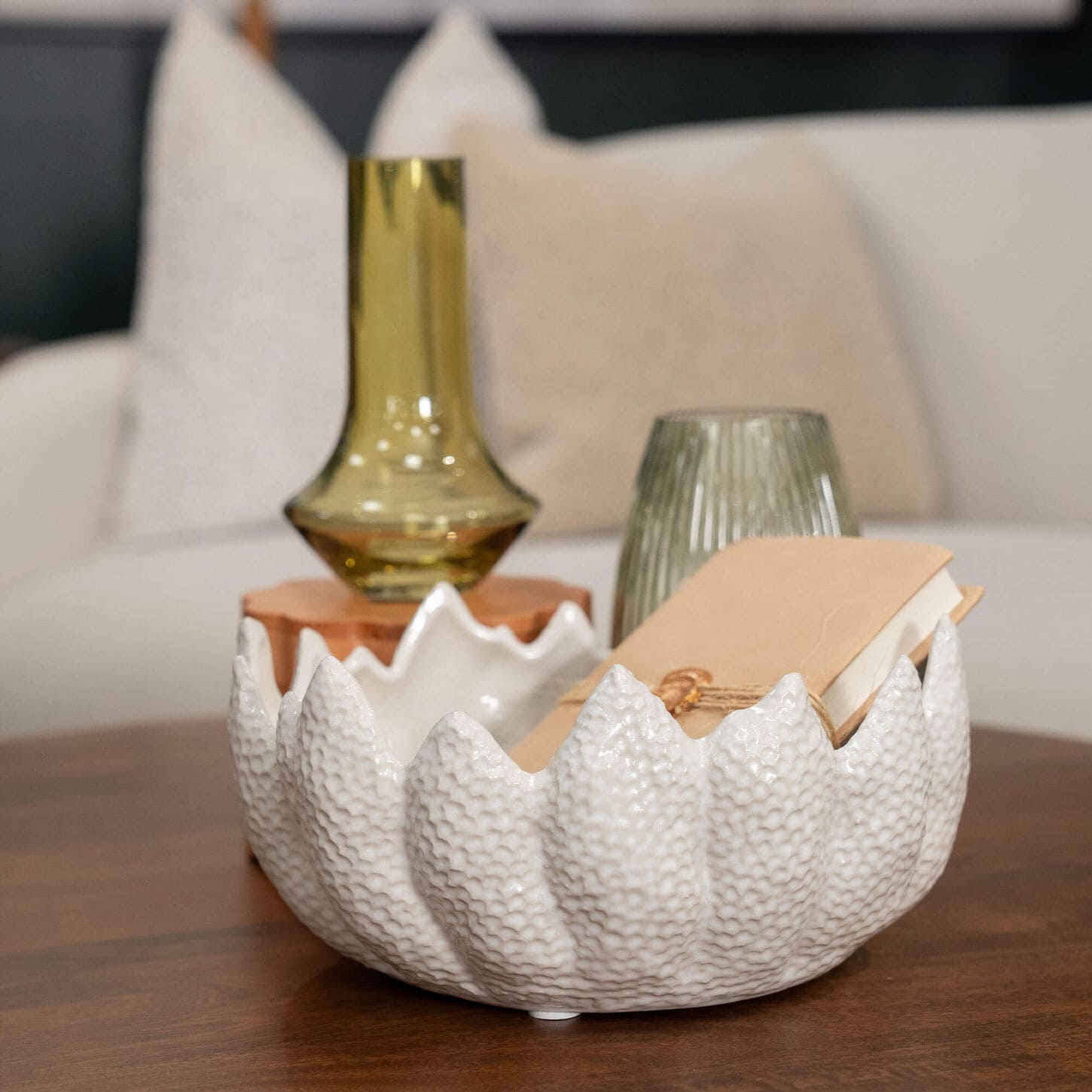 Bowl next to other home decor sitting on a coffee table
