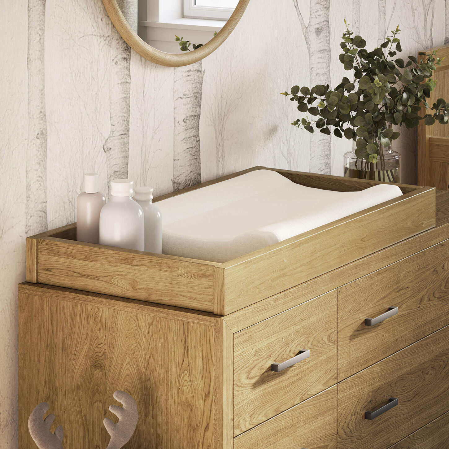 baby changing table with decor and wall art