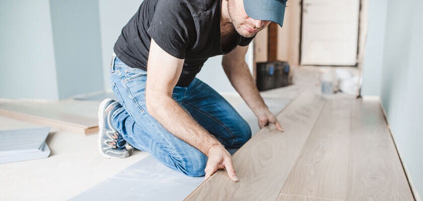 Man installing hard surface flooring