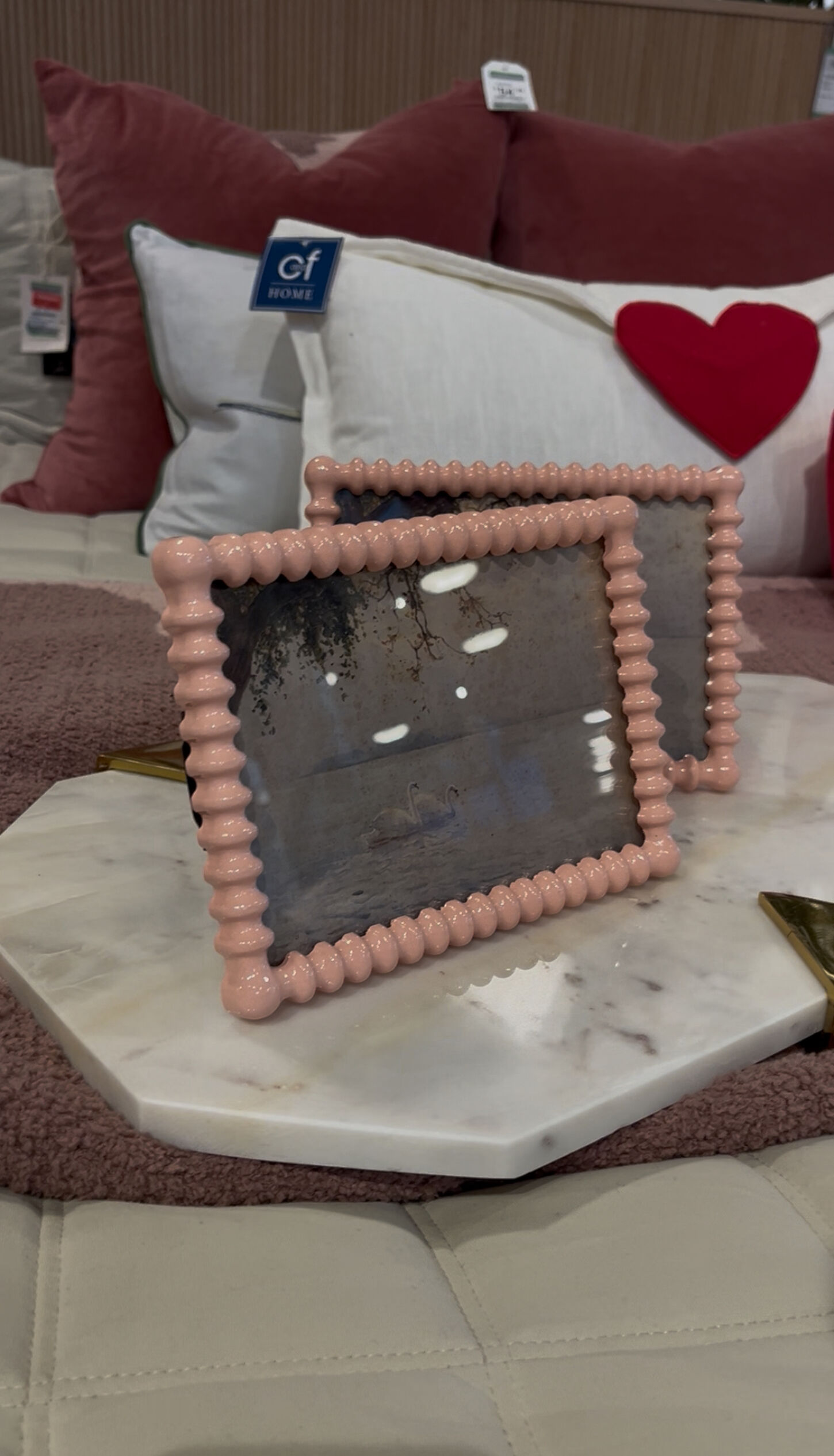 Pink frames sitting on stand