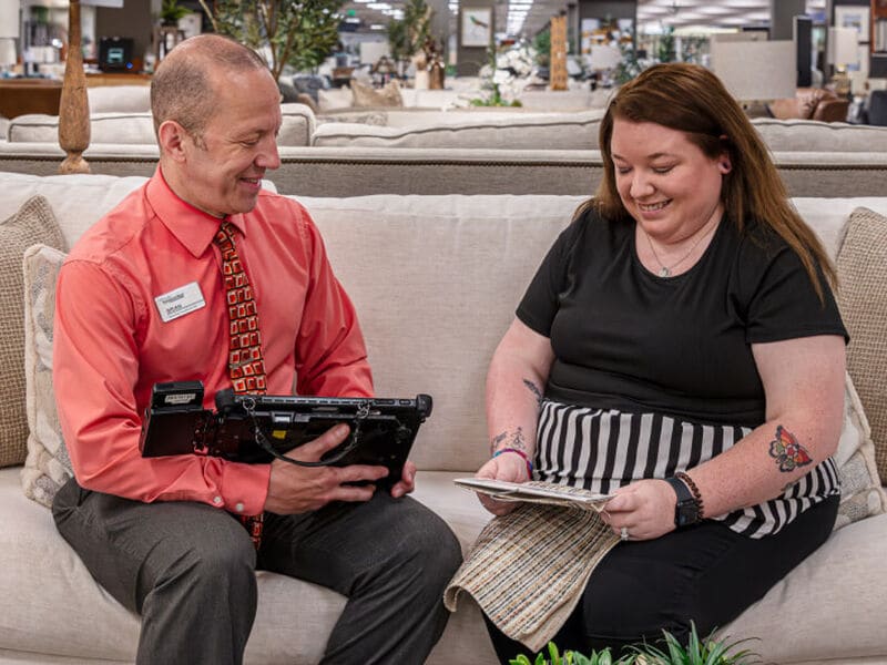 A store employee meeting with a customer in store