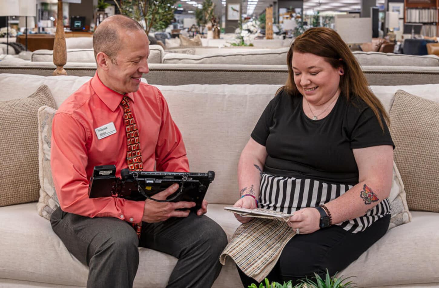 A store employee meeting with a customer in store