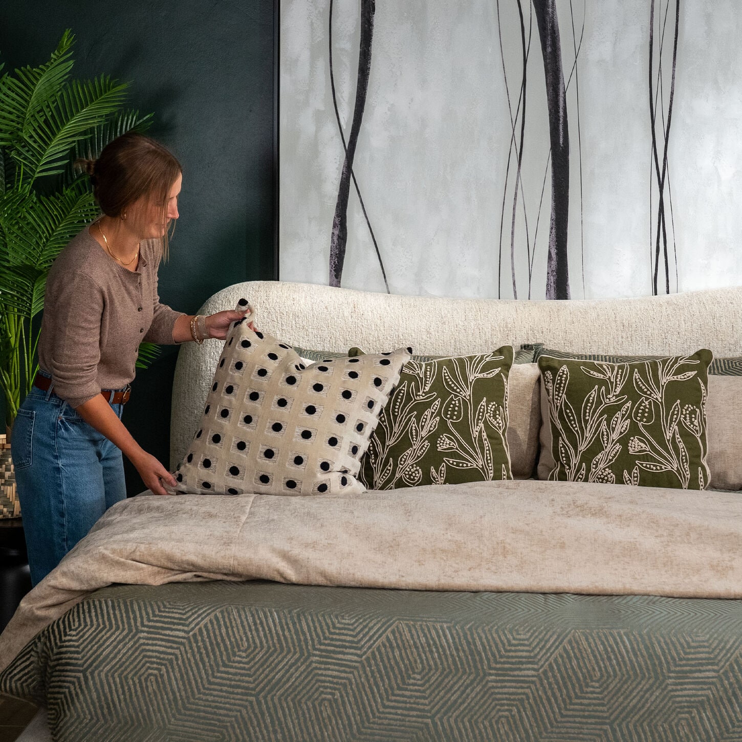 Sydney putting pillows on her bed