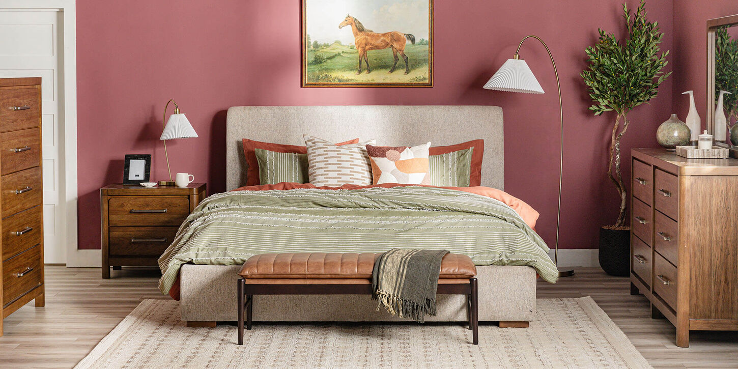 Pink bedroom with rustic decor and wooden bedroom set