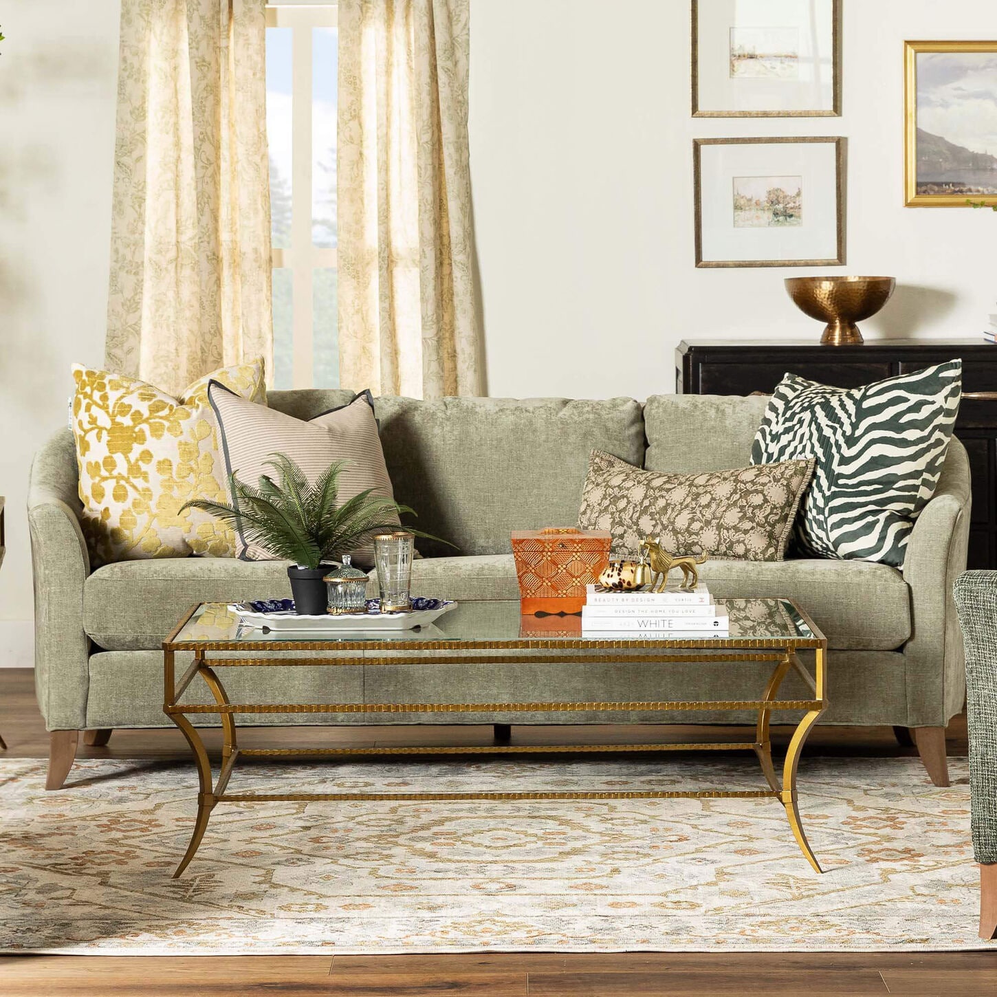 Green sofa with gold coffee table