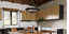 Rustic style kitchen with Hunter chandelier hanging above the table 