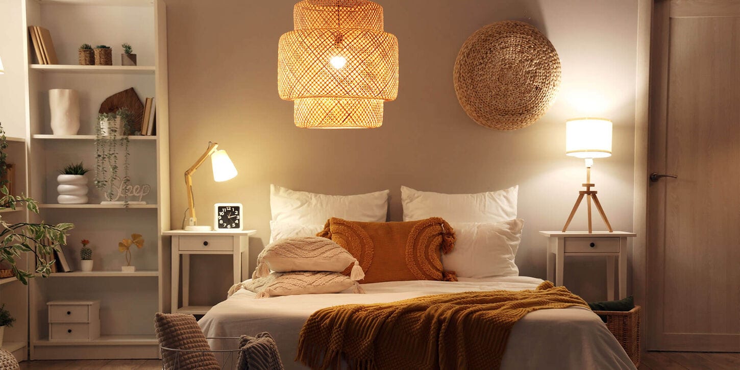 Bedroom with 3 different types of lighting and bookshelf