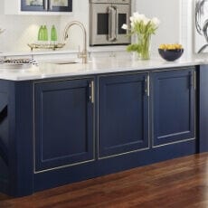 Kitchen with vibrant blue cabinets and white countertop