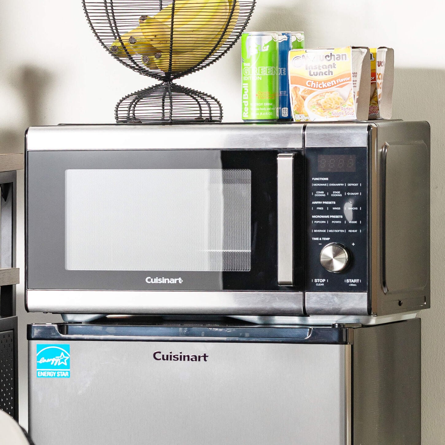Microwave on top of a dorm fridge