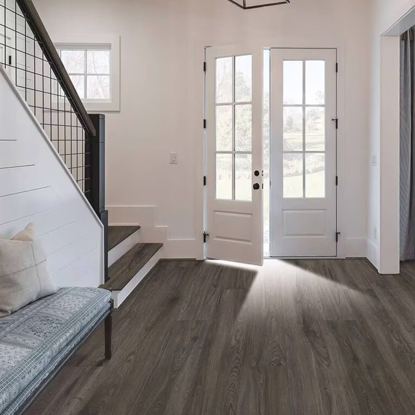 entry way with stairway on the left and light wood vinyl plank flooring