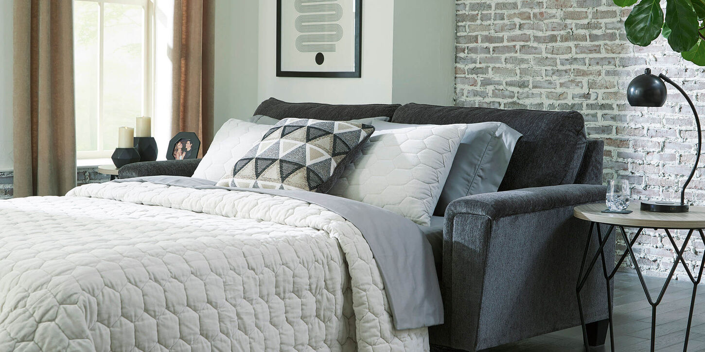 Sleeper sofa pulled out and made into a bed