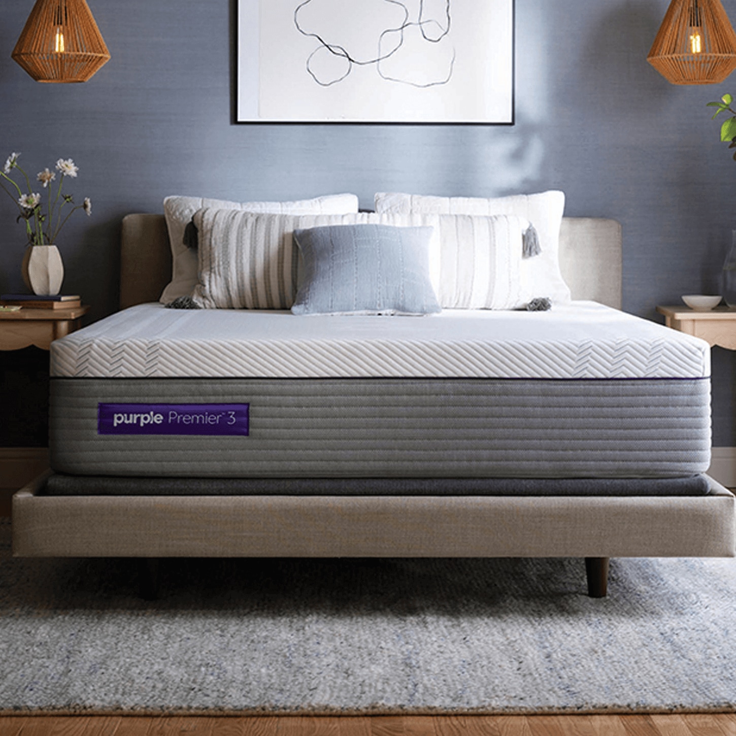 Purple mattress on bedframe with blue walls