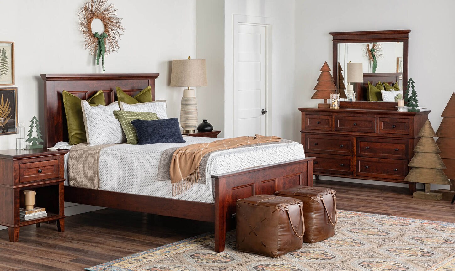 A wooden set bedroom with Christmas trees for decor.