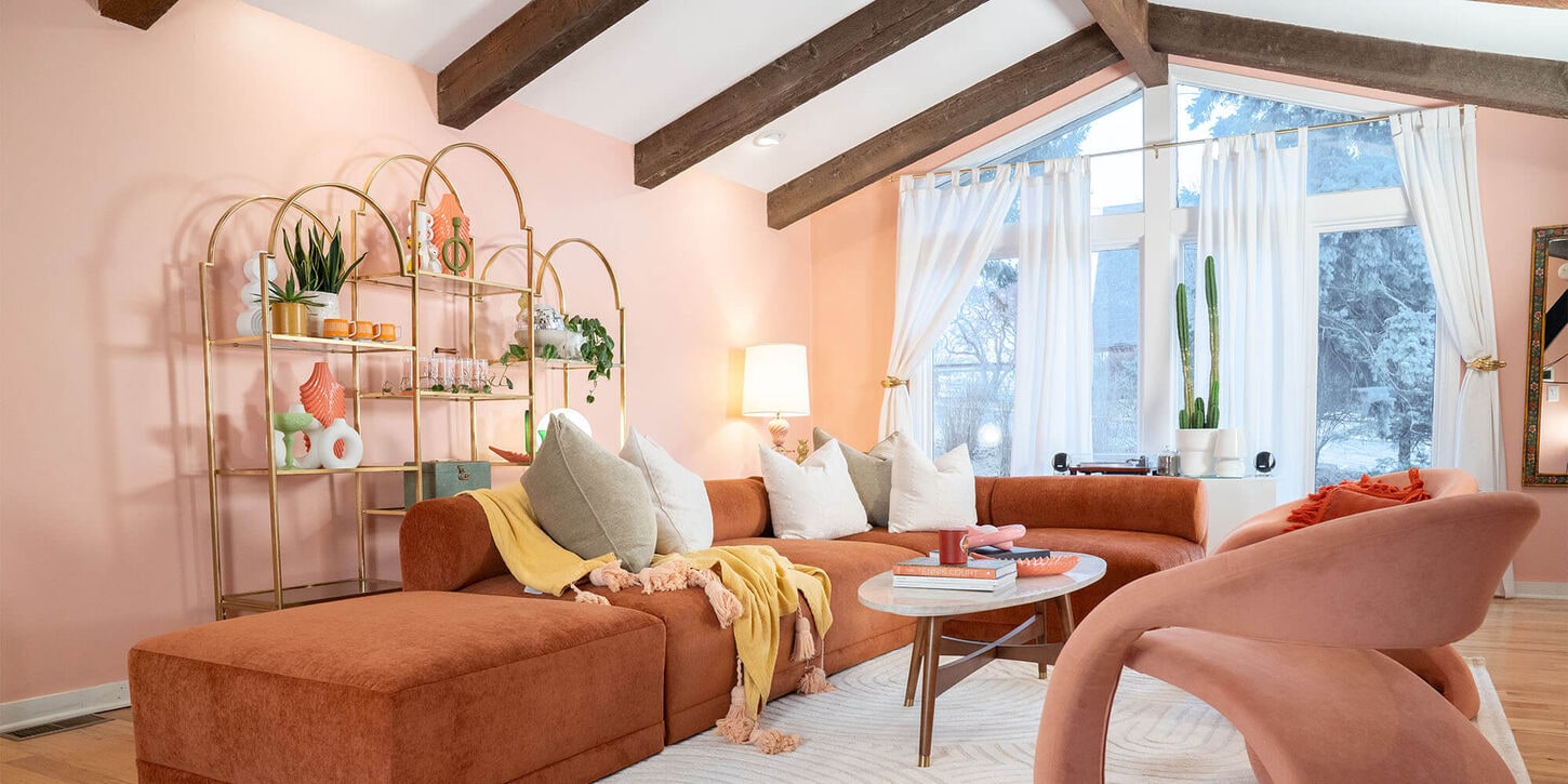 37b living room including sofa, pillows, a chair and coffee table with decor