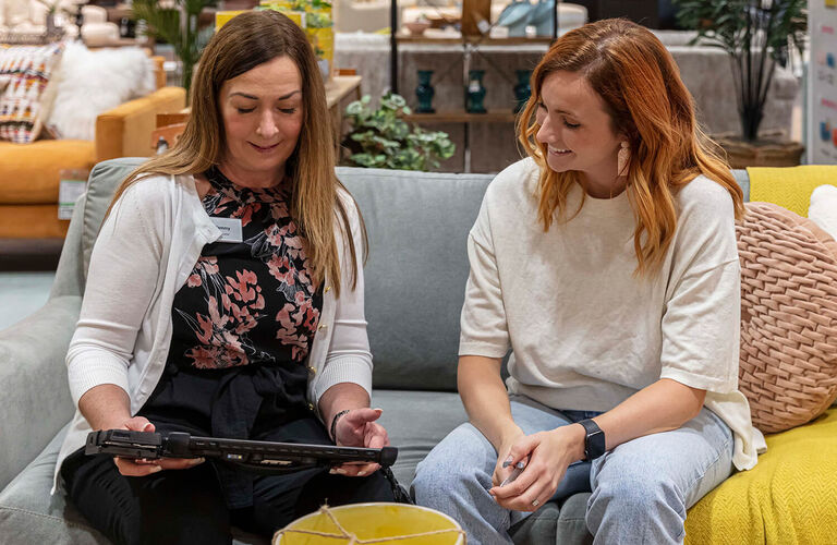 Couple Inside Store with Sales Professional