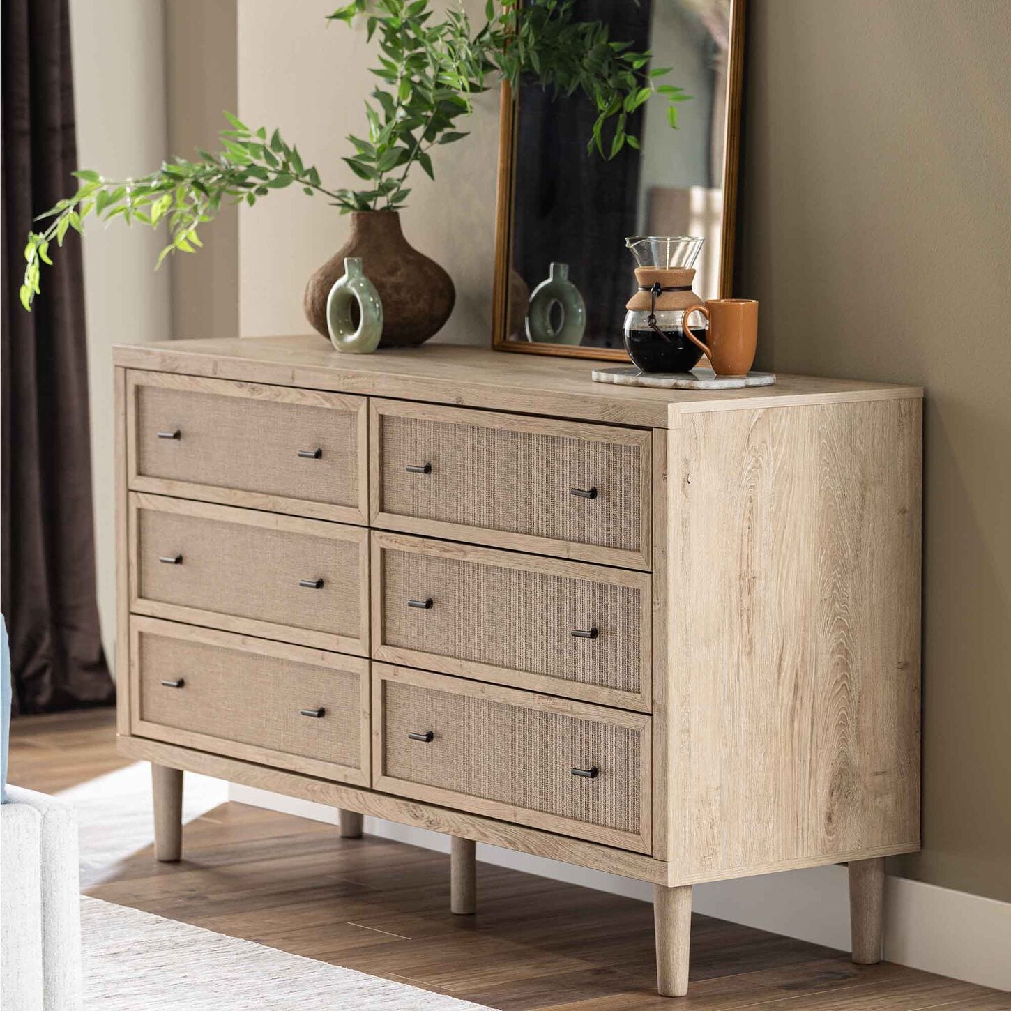 Light-finished 6 drawer dresser with wicker panels