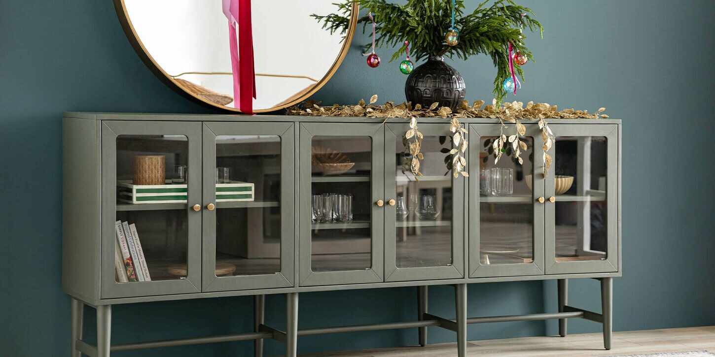 buffet table for storing dining ware decorated with Christmas and Holiday decor