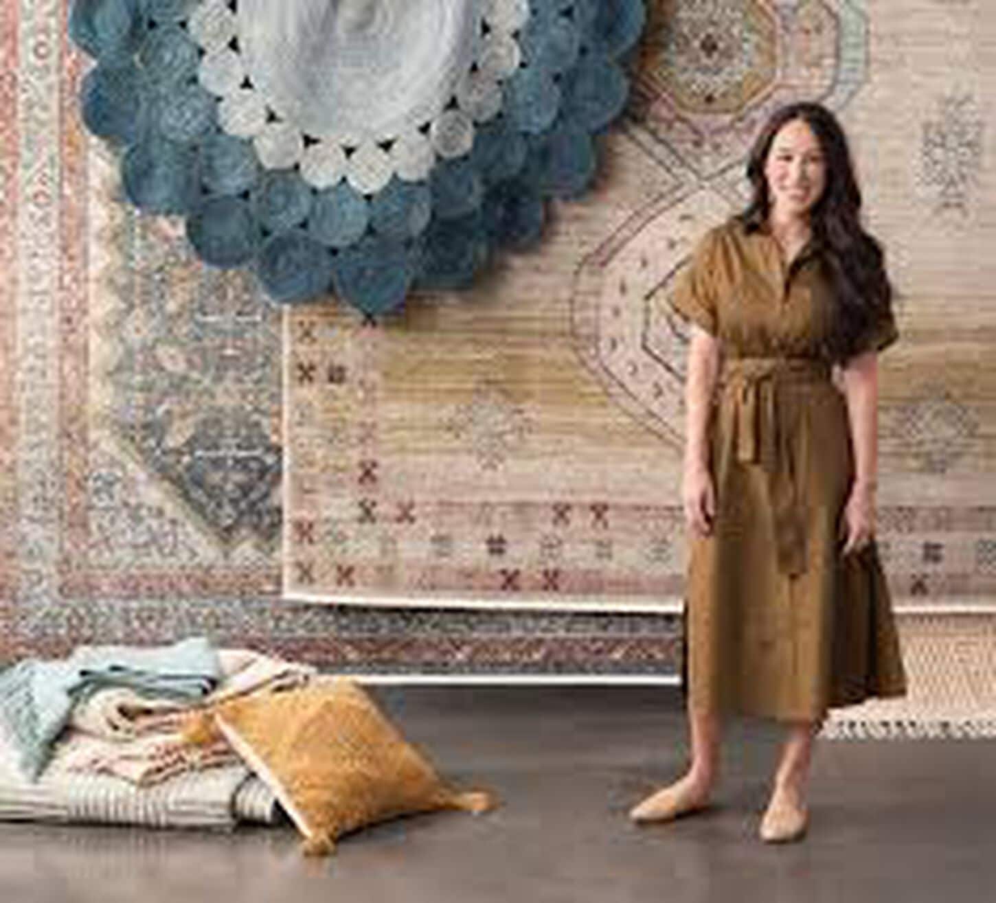 Joanna Gains posing with her Magnolia Home rugs