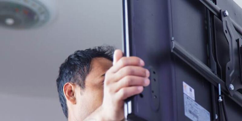 TV being installed in home