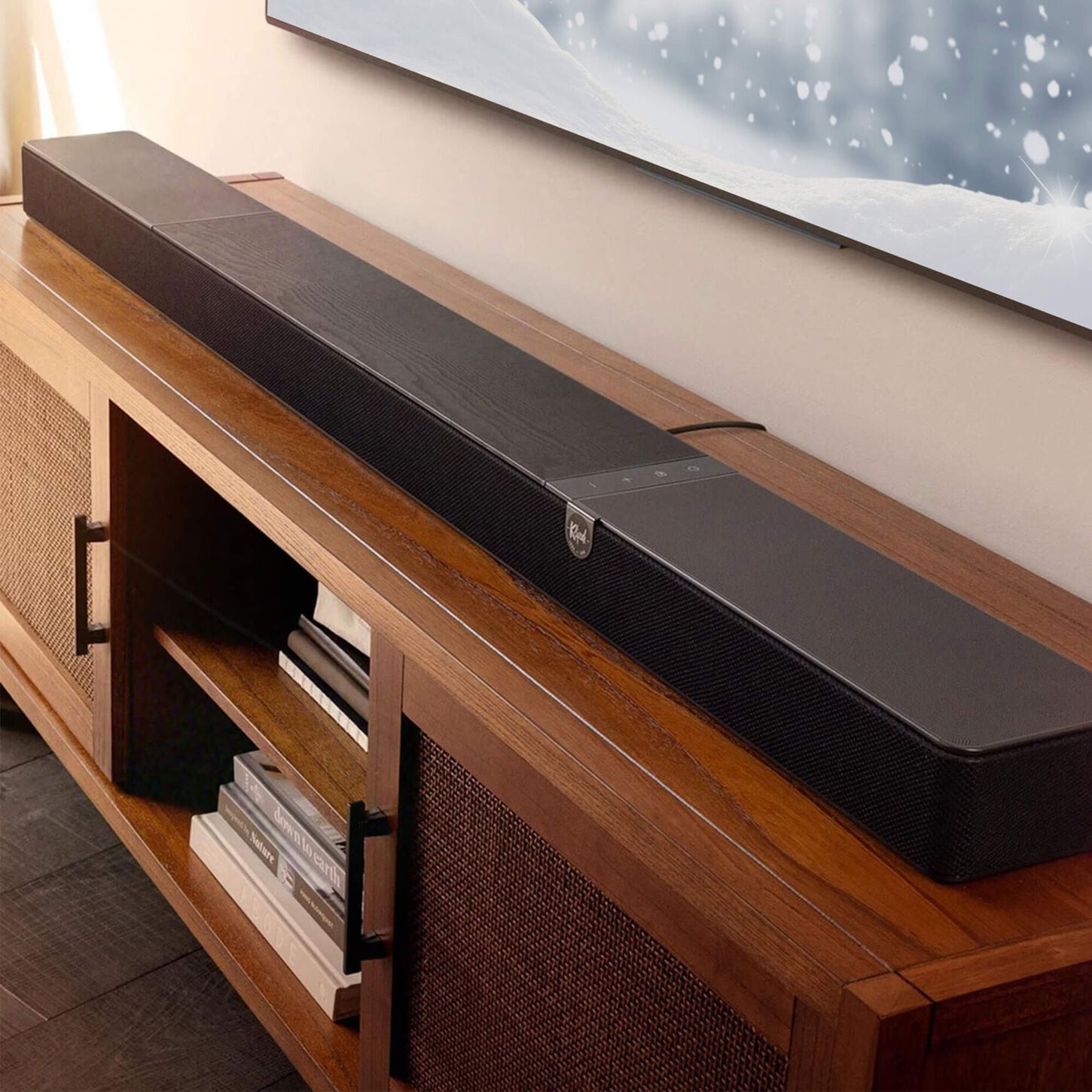 Soundbar on light wood TV stand