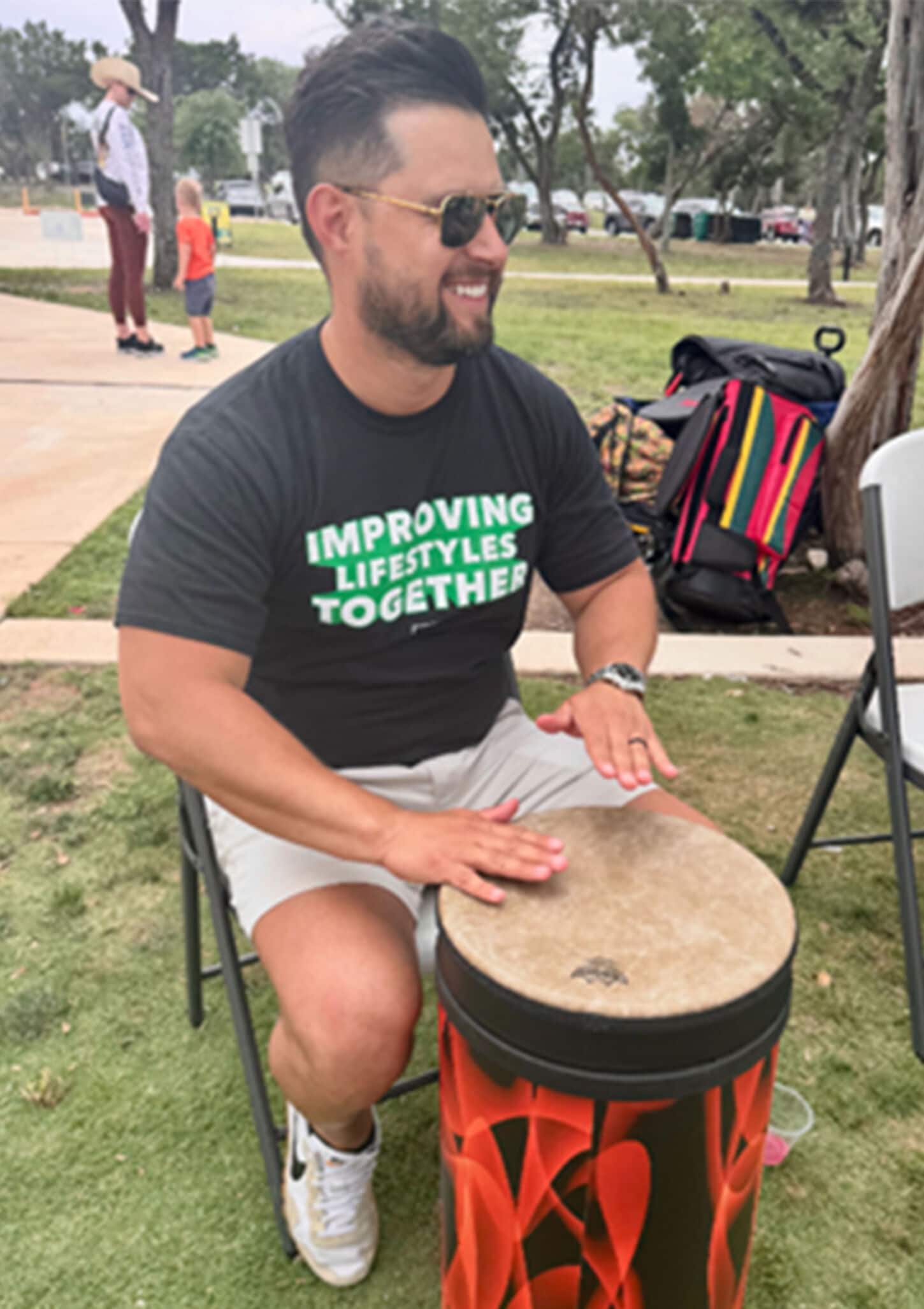 Cedar Park Earth Day event with man playing on a drum