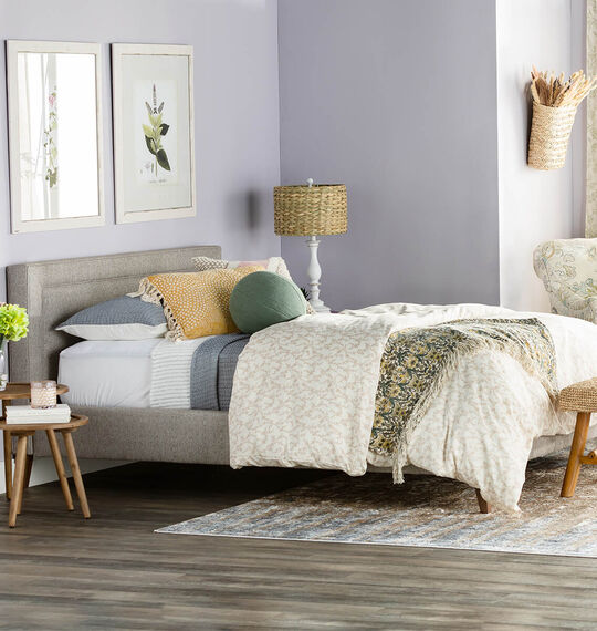 Bedroom with lavendar walls with bright and modern pastel decor