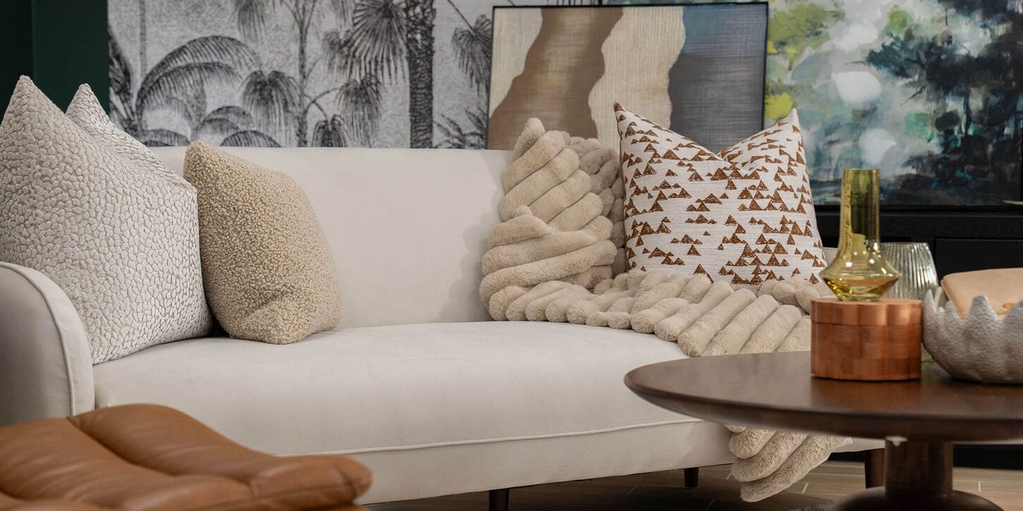 37b living room including sofa, pillows, a chair and coffee table with decor