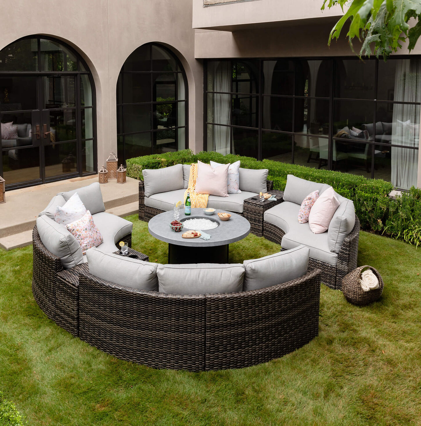 Outdoor sectional with food and wine on table