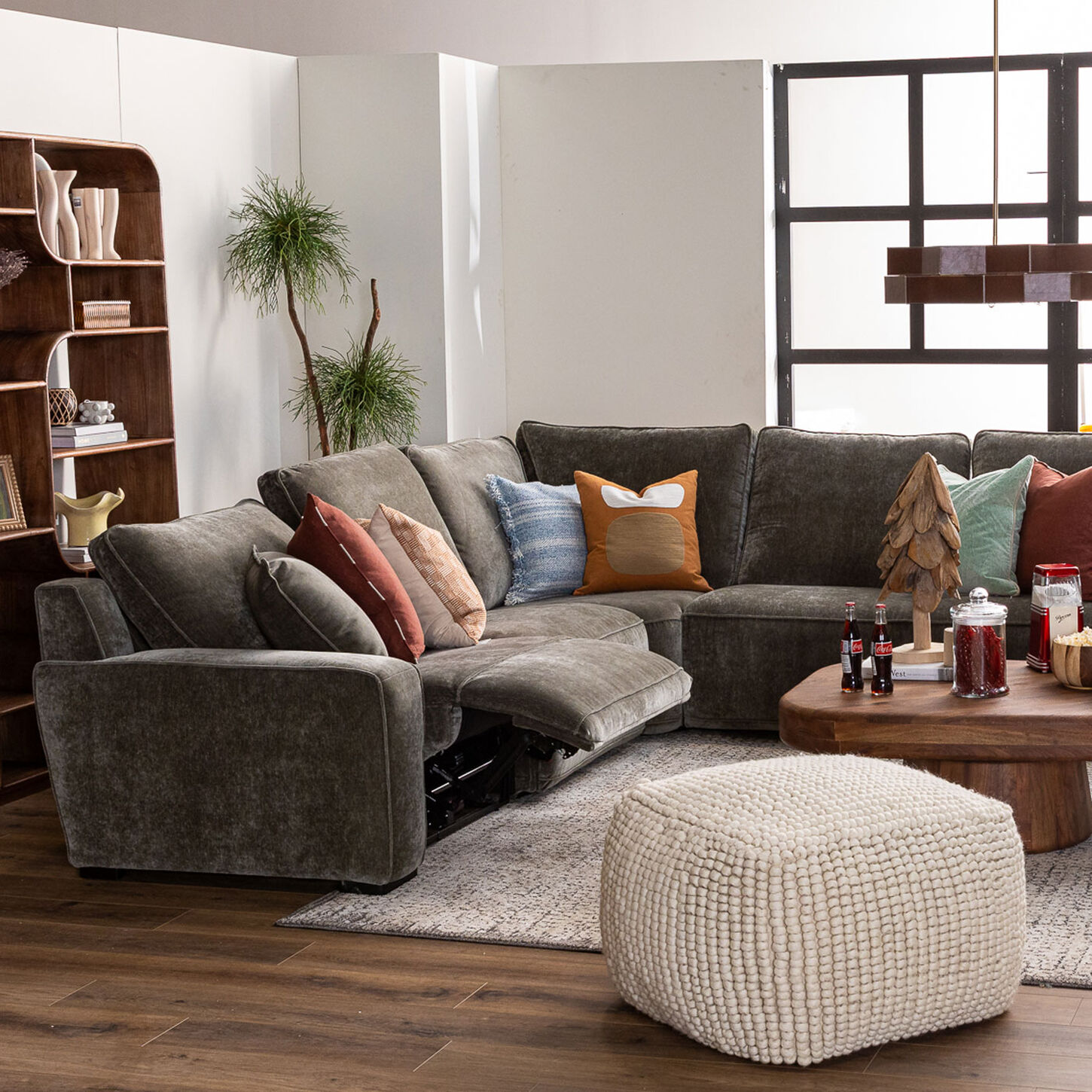 Green reclining sectional in living room scene