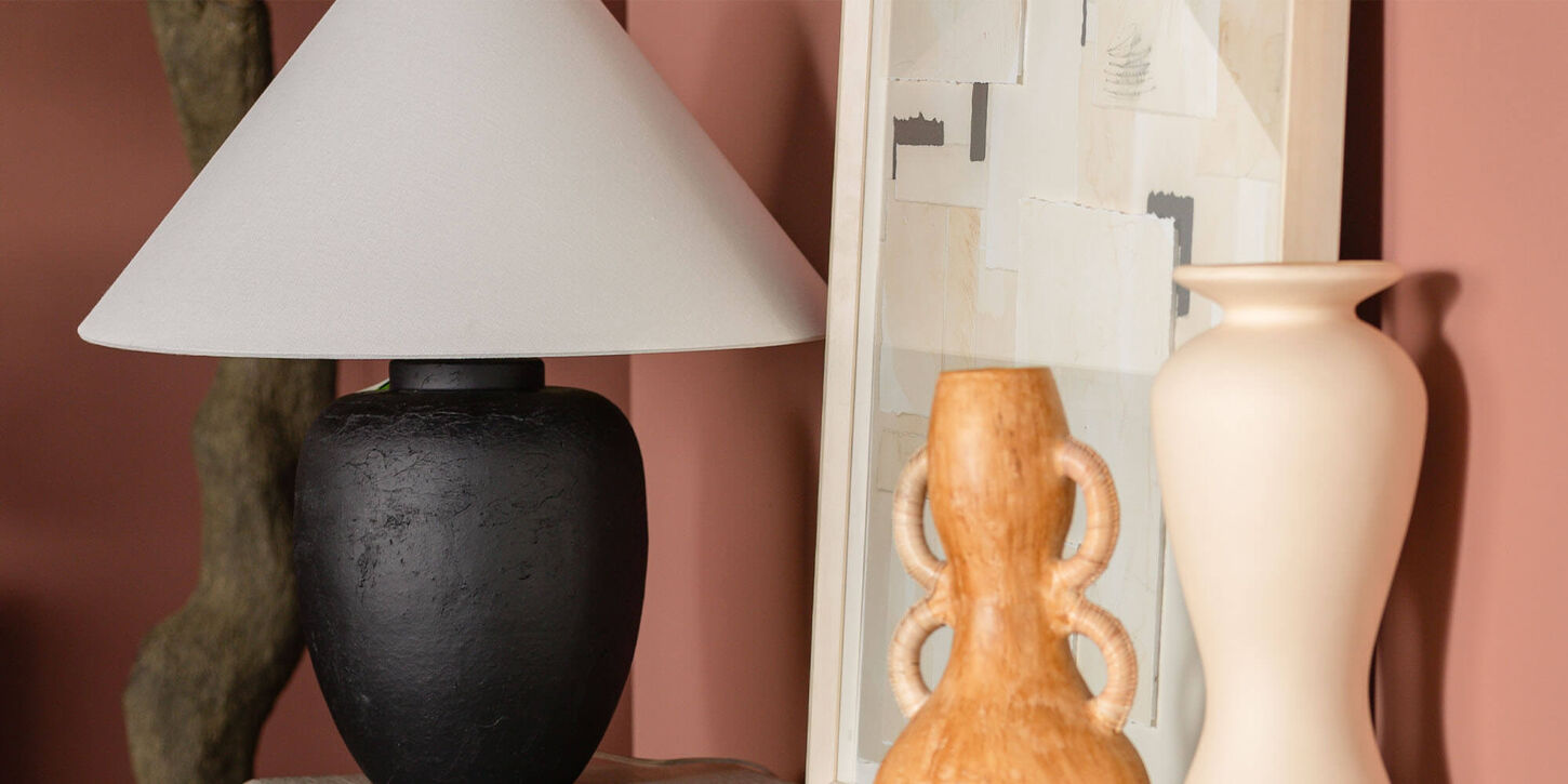 Lamp with vases and picture in living room