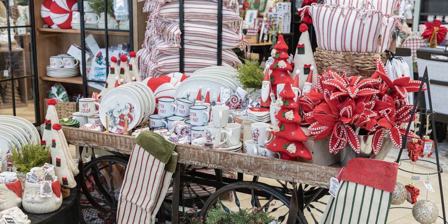 red and white winter decorative accessories placed on a wooden cart