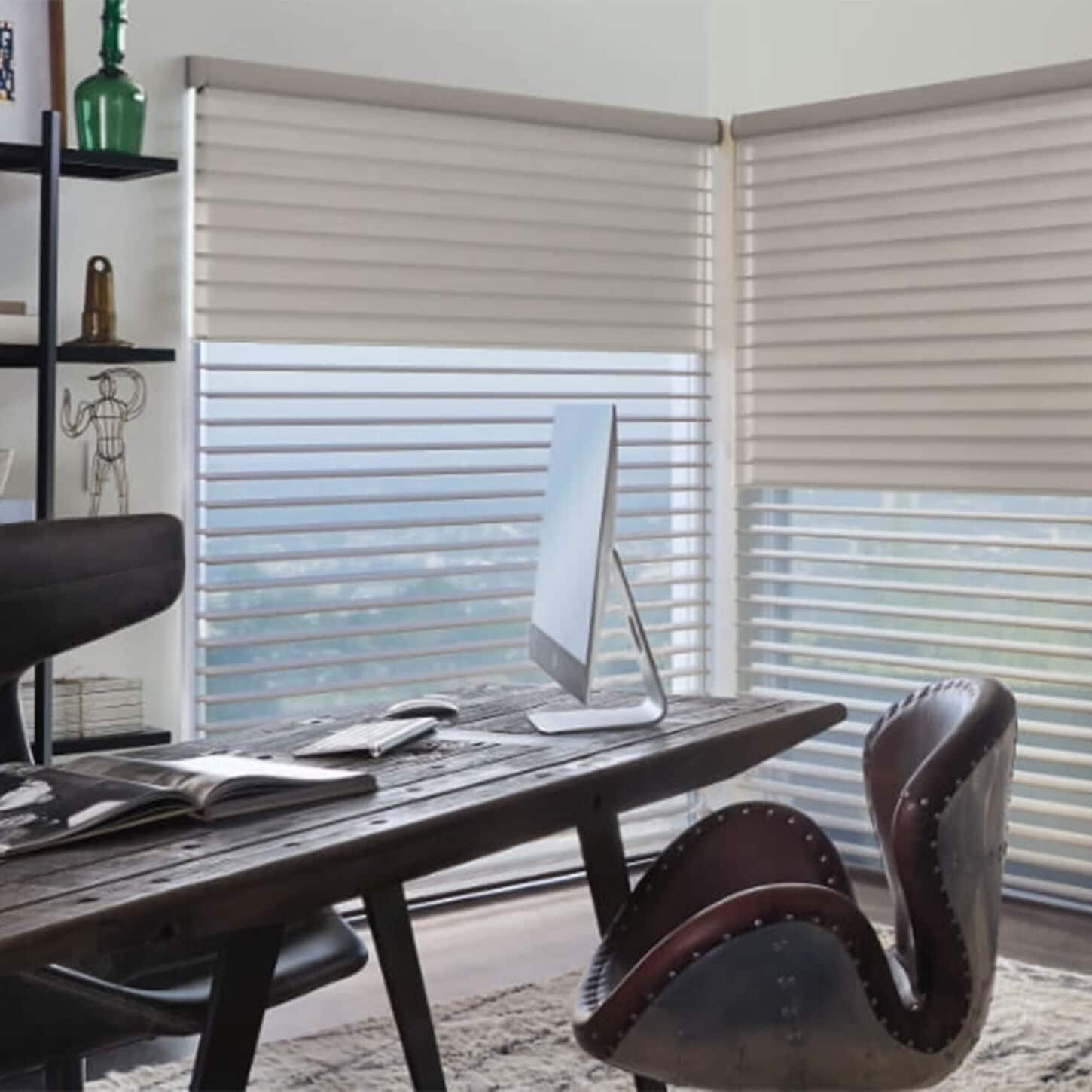 office with desk and leather desk chairs and white louvered window coverings