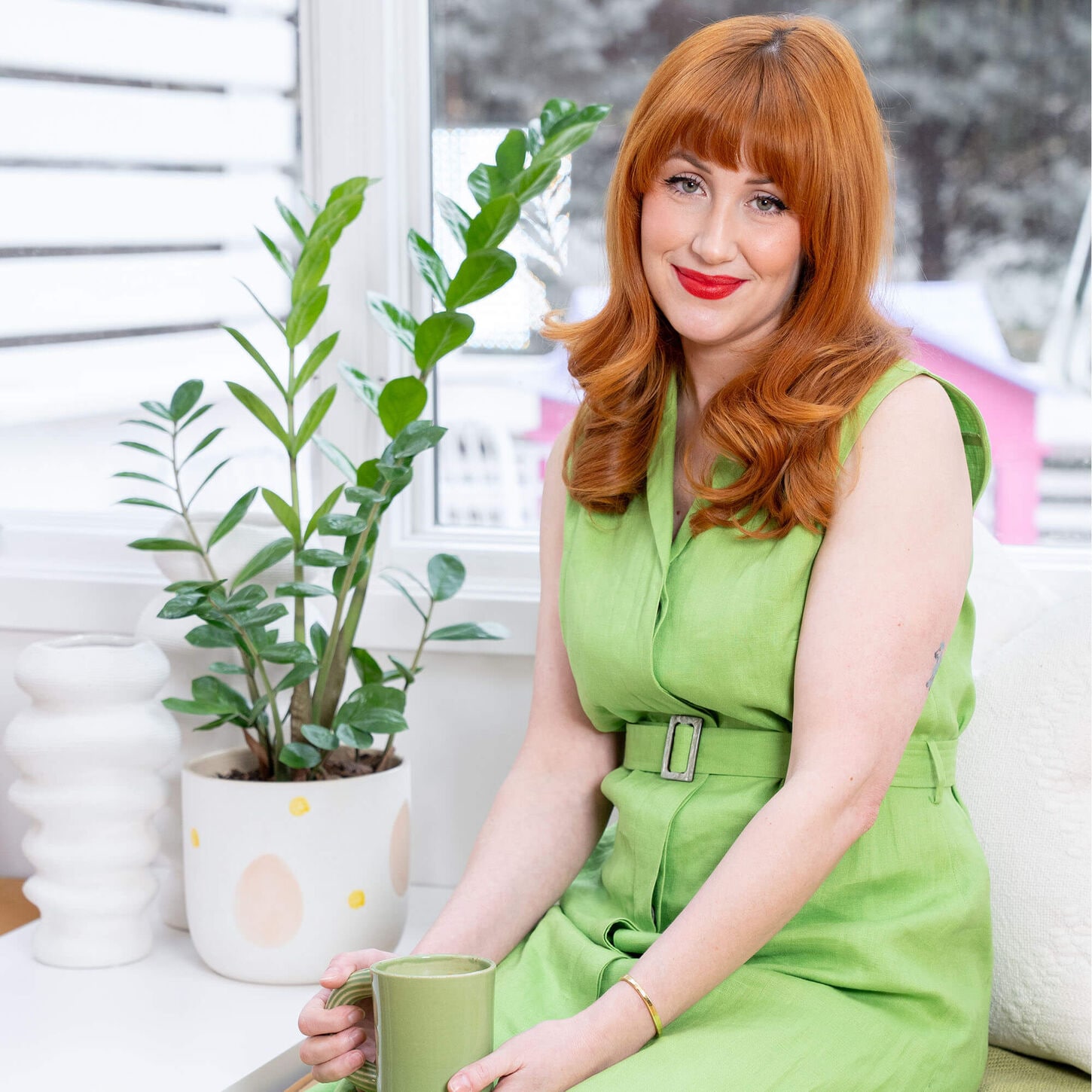 Sarah sitting near the dining room with her 37b limited drop launch