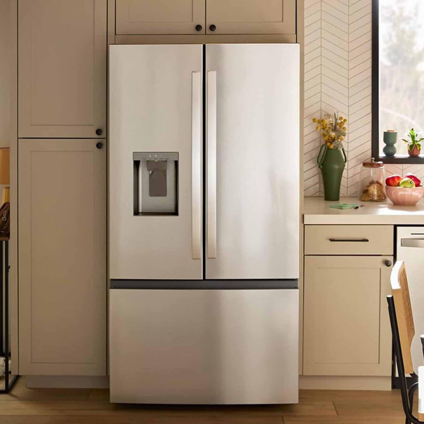 Stainless steel 2-door refrigerator in a brown kitchen