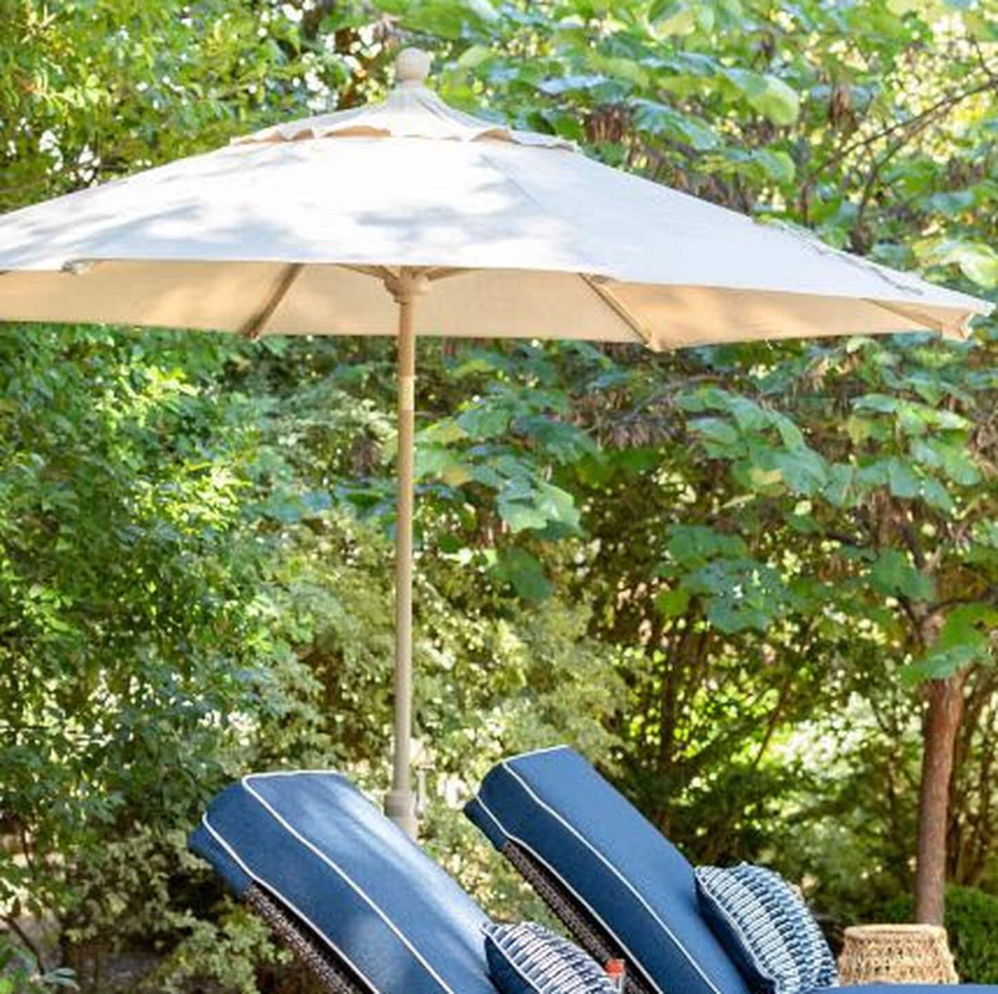 Patio Umbrellas open over 2 chaise lounges