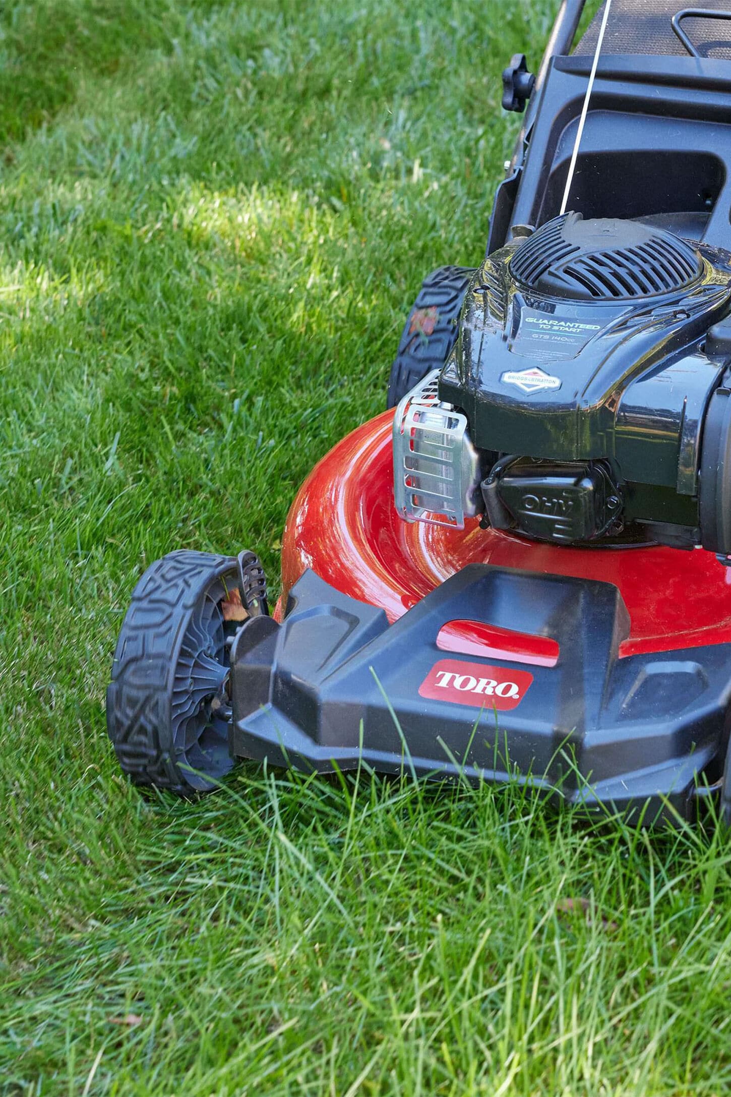 Lawn mower moving grass outside