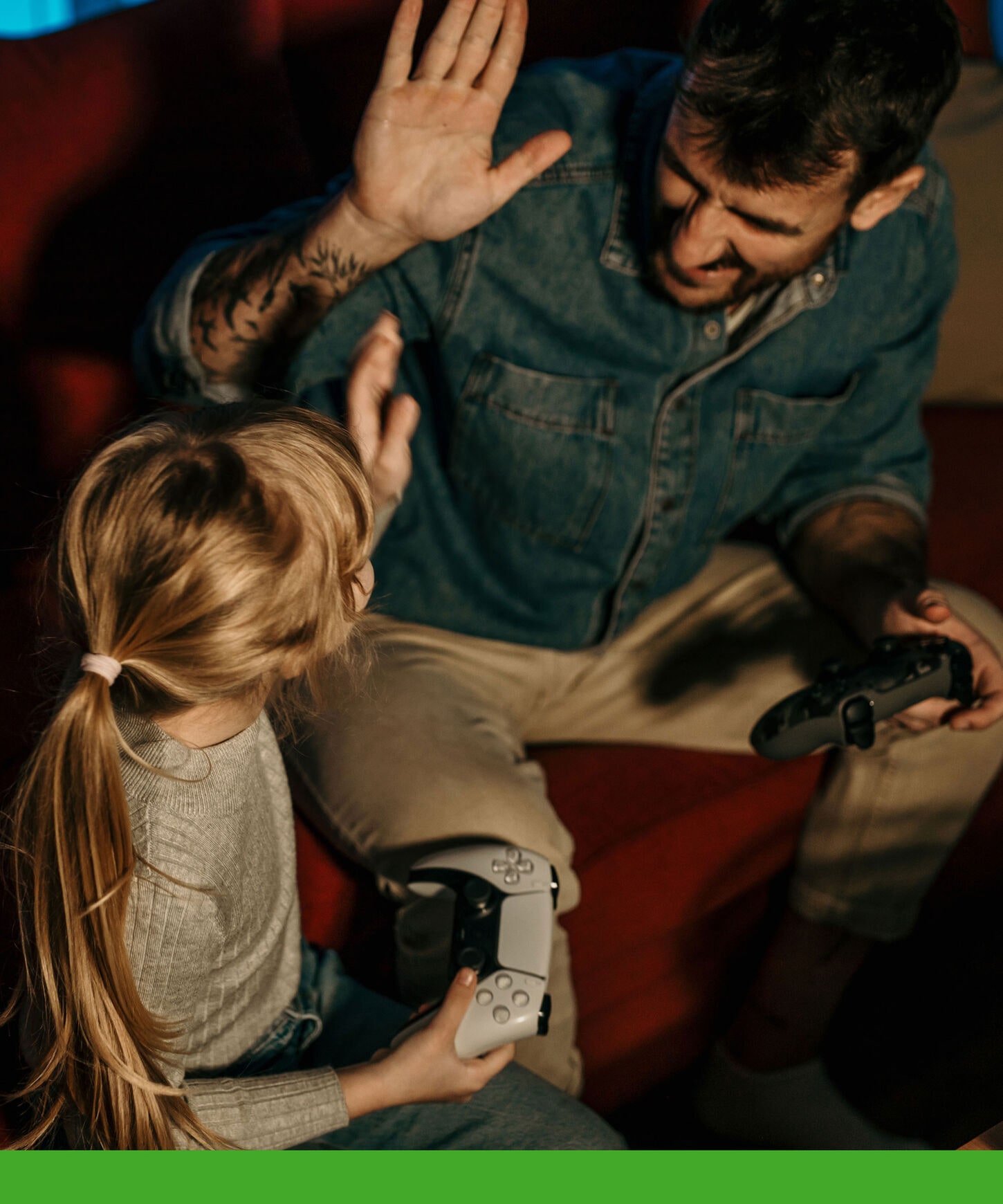 person playing video games with daughter