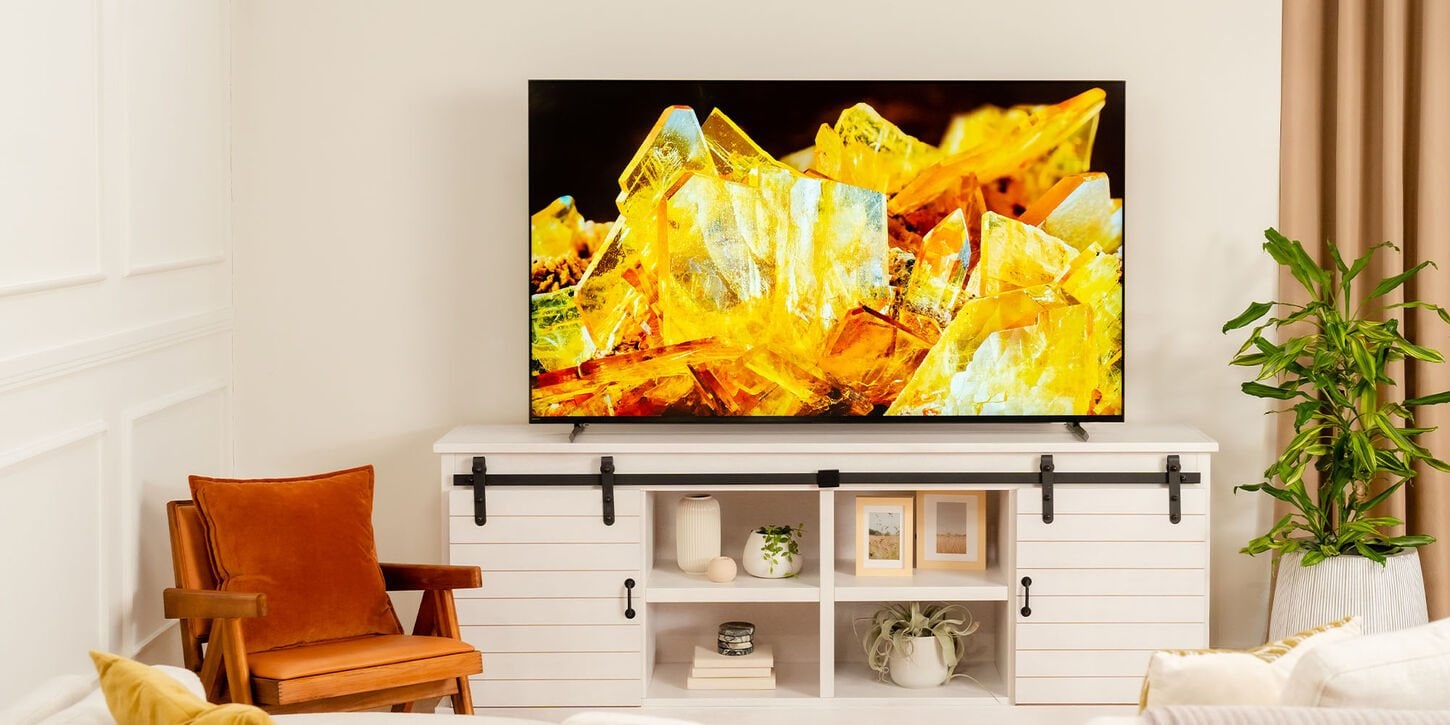 family in living room watching tv on the sony tv