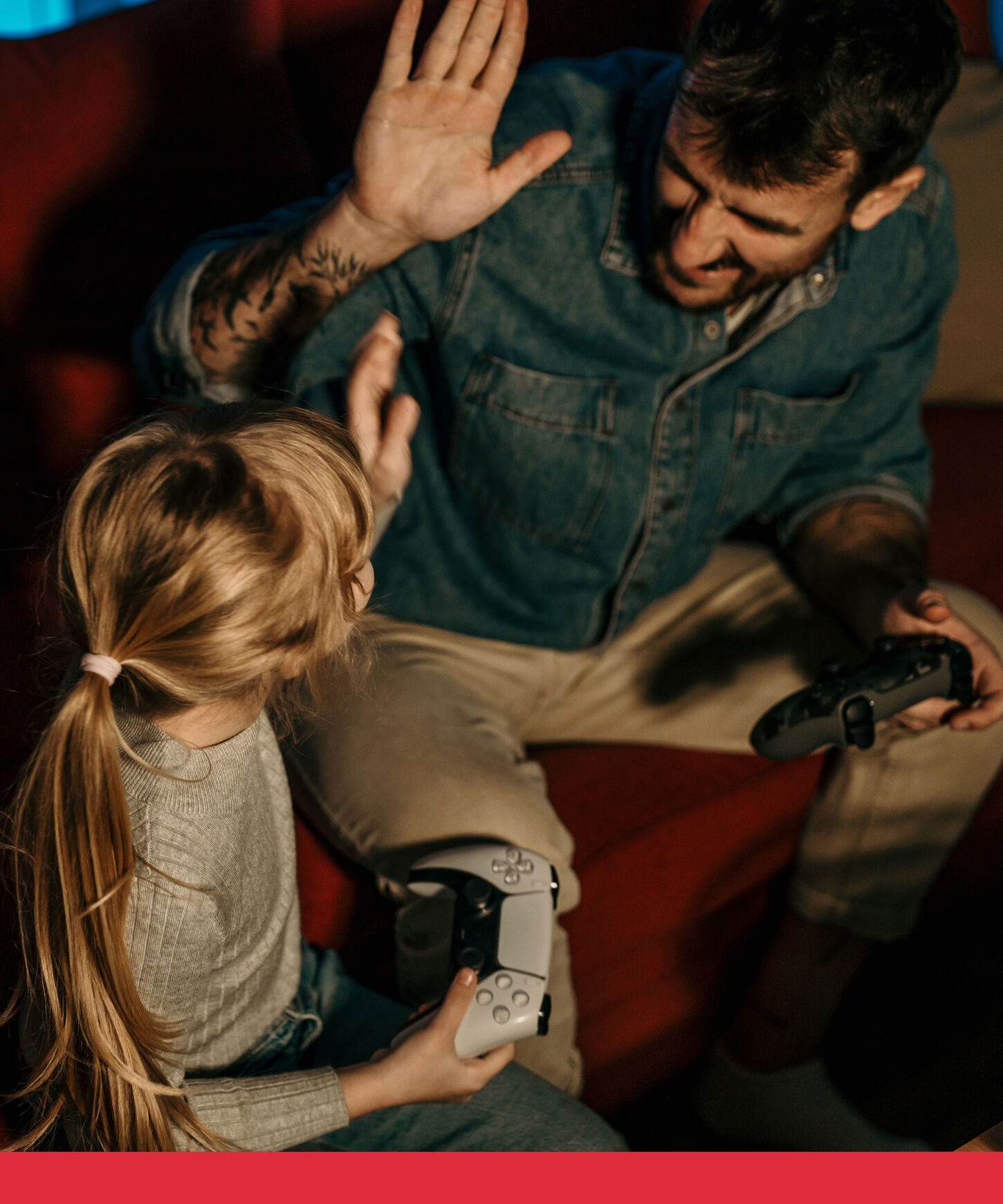 person playing video games with daughter