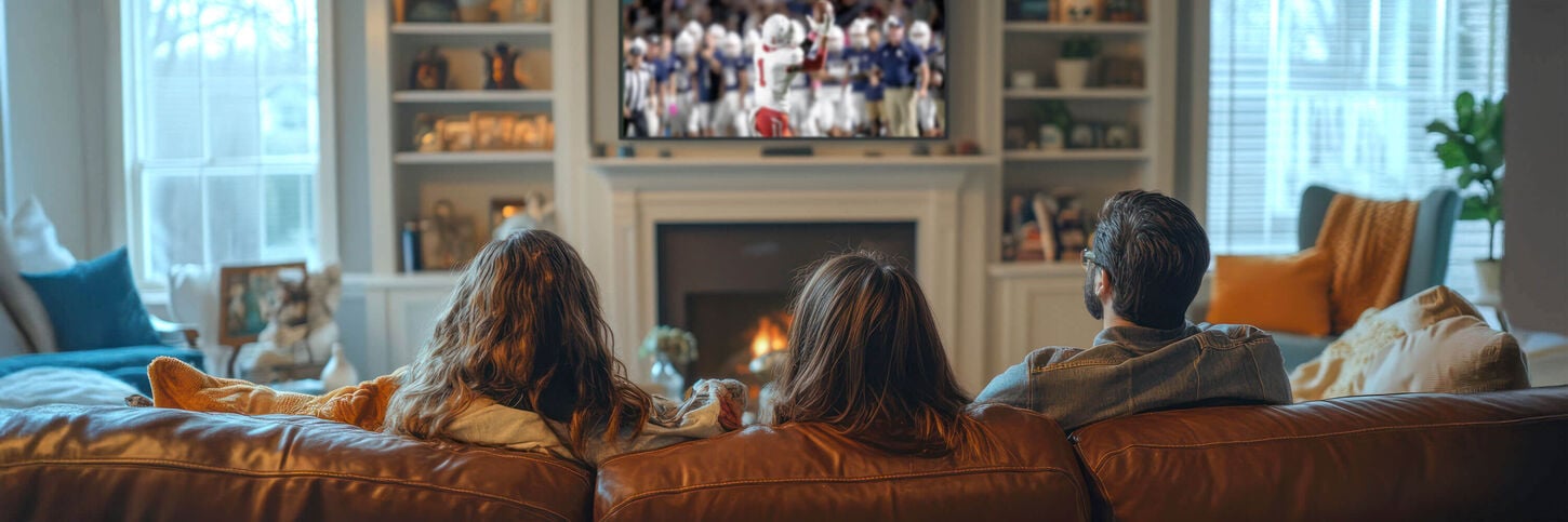 Couple playing video games in living room