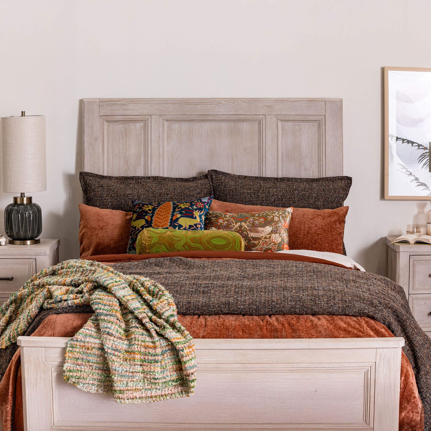 Bed with pillows and throw blanket