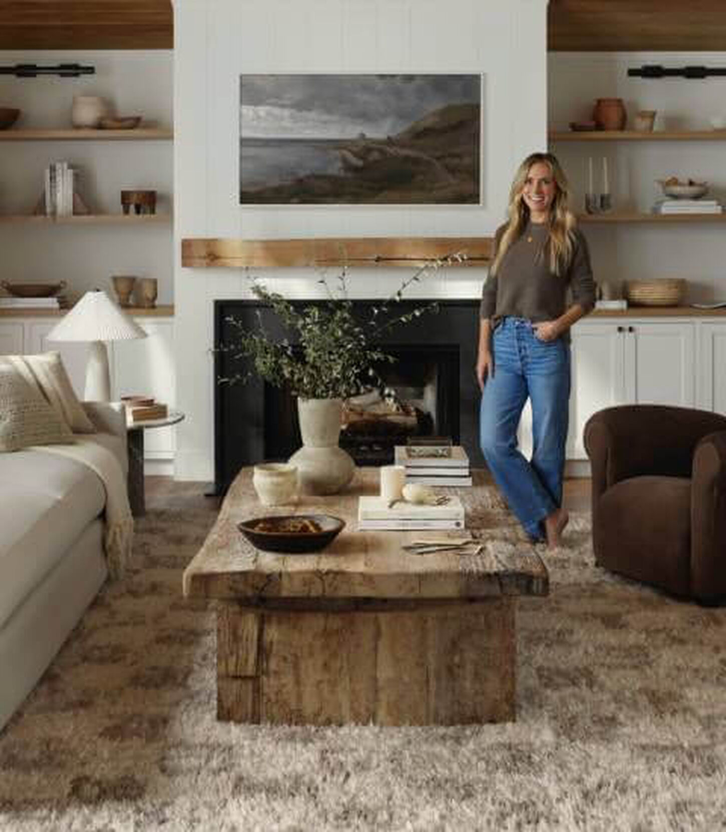 Angela Rose Rug in living room with coffee table, sofa, fireplace and decor